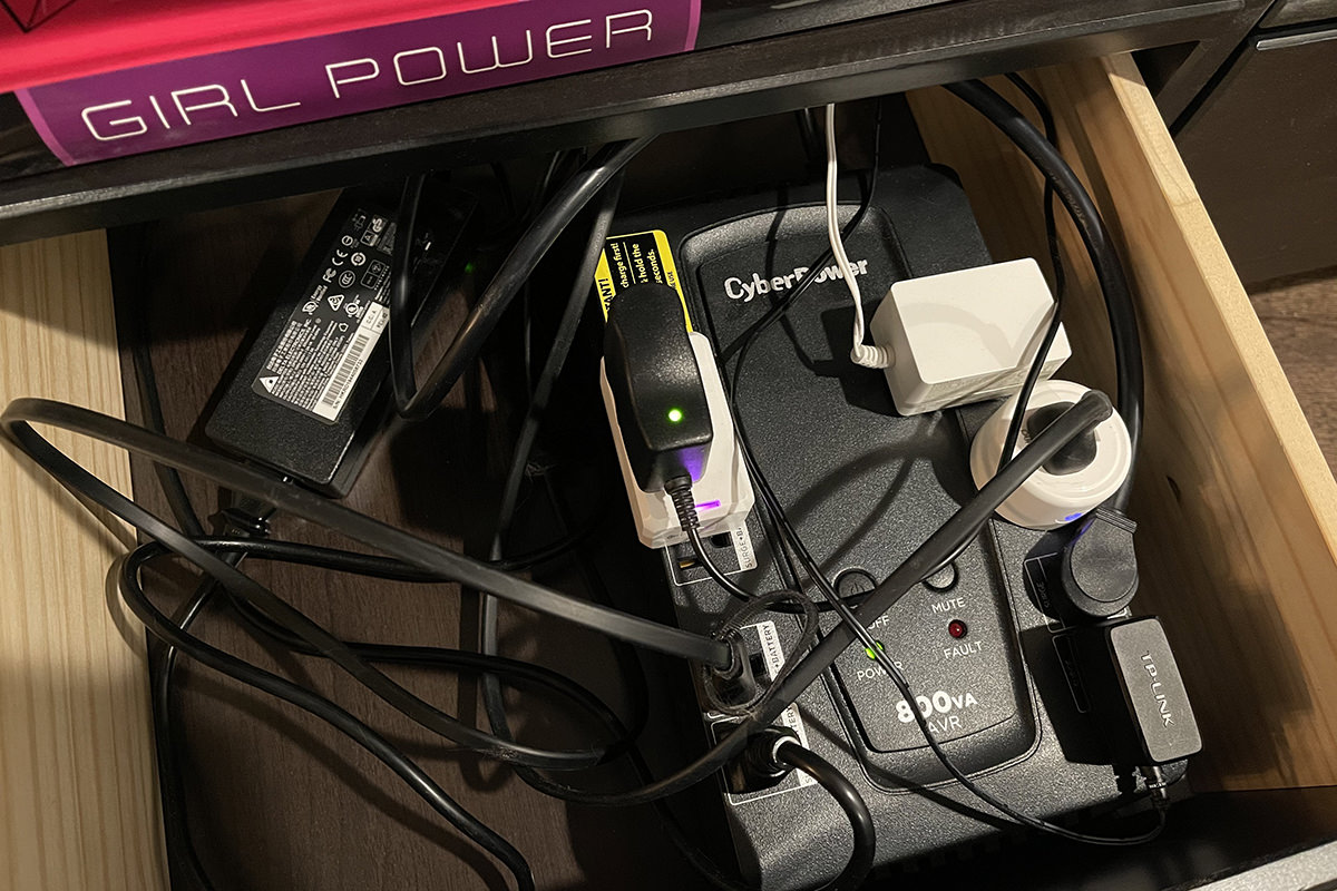 My Uninteruptable Power Supply in a drawer with a mess of power cables.