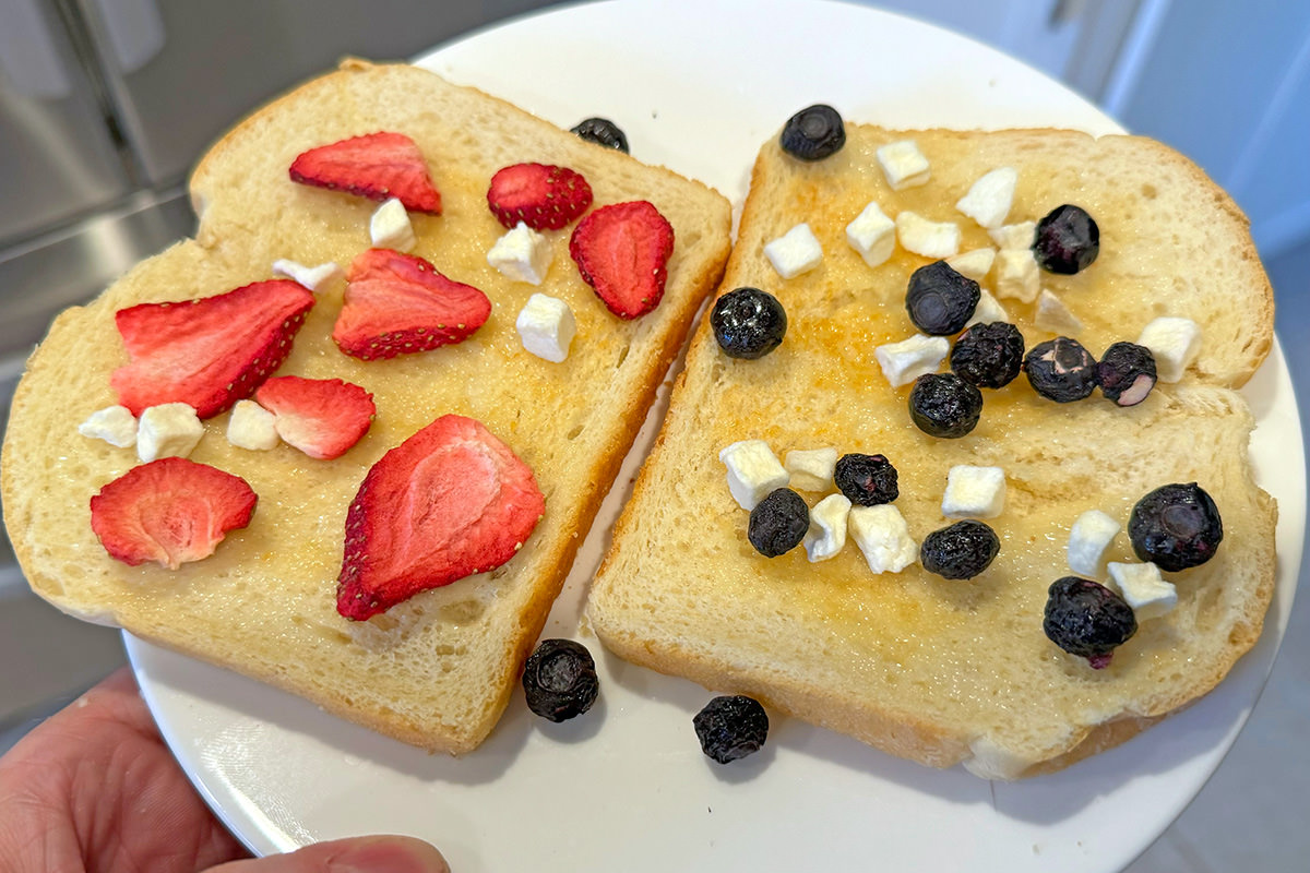 Freeze-dried apples, blueberries, and strawberries on toast with plant butter.