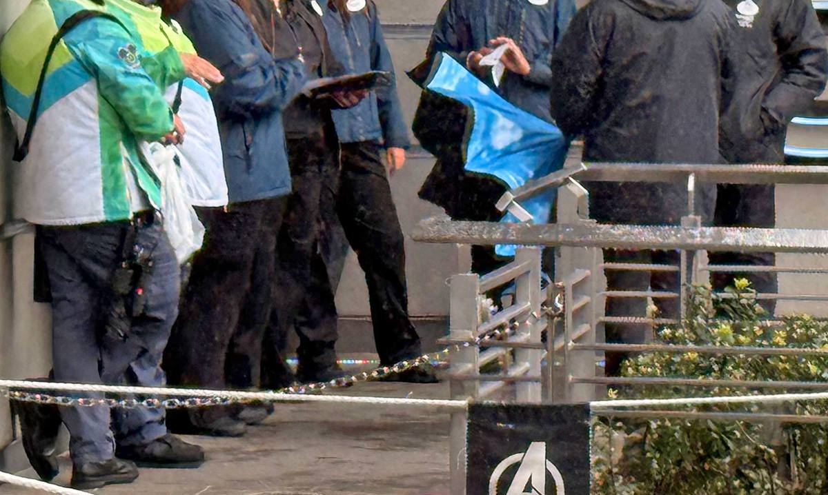 Eight employees standing around doing nothing