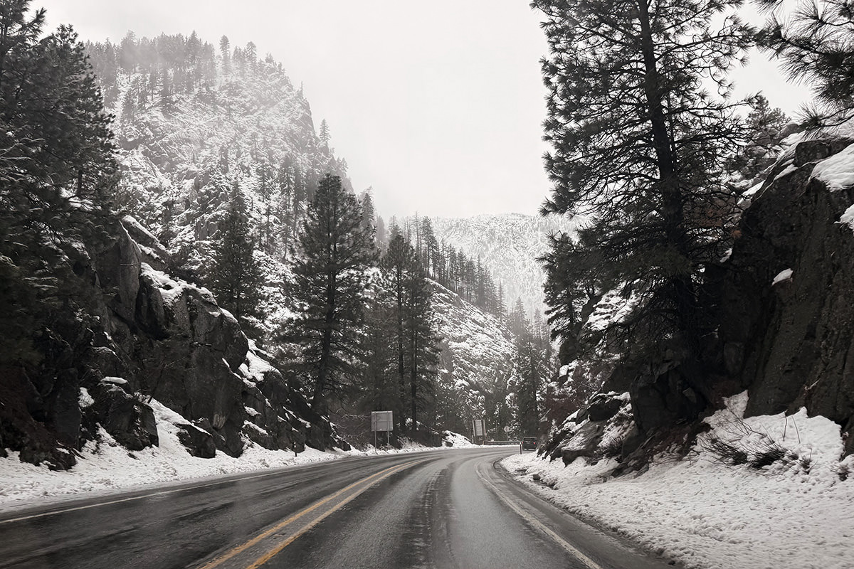 Driving through the mountains in the snow.